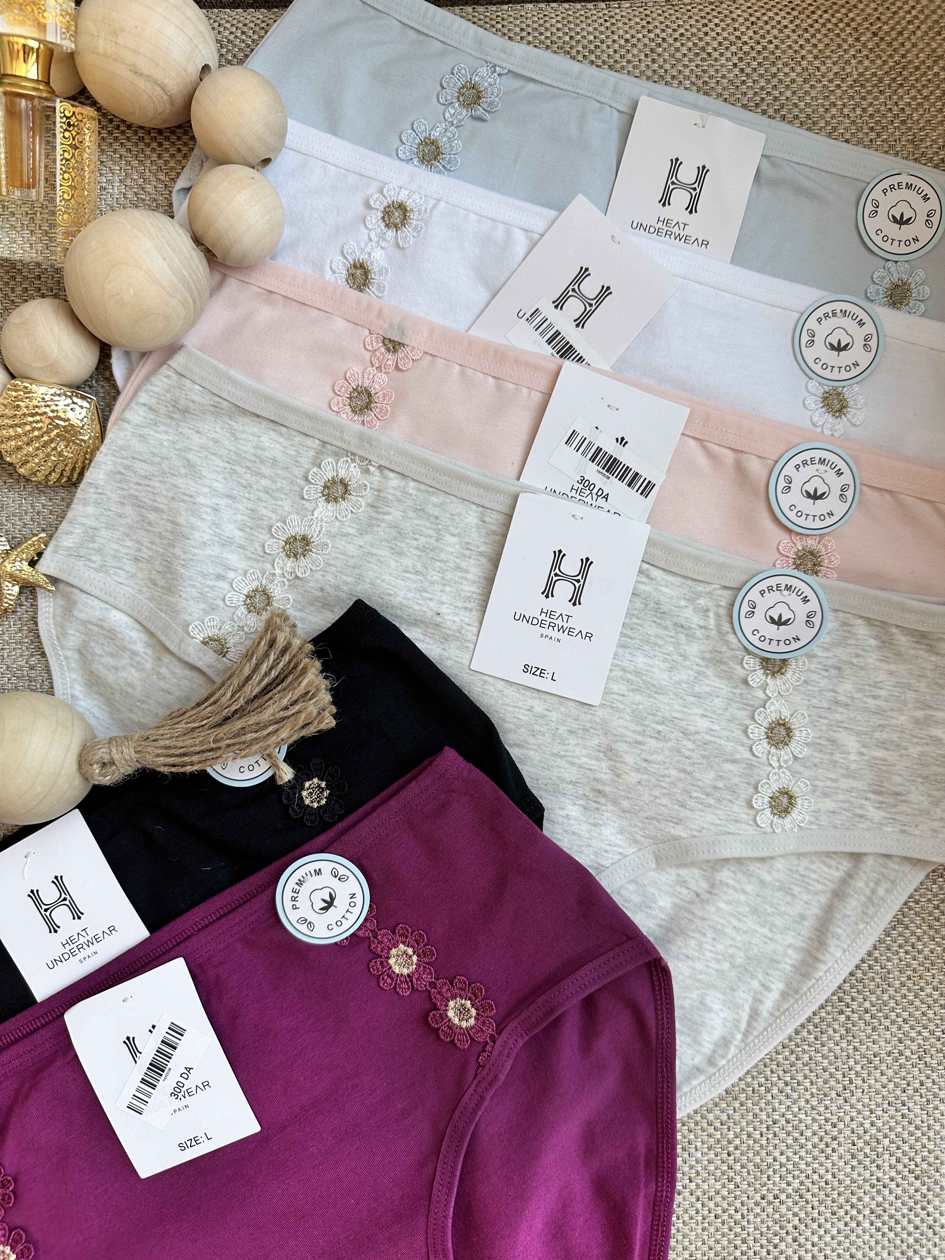 slip H fleur a coté 